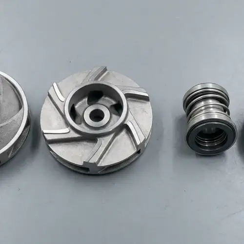 Top-down workbench comparison of a sewage vortex impeller and high-chrome slurry impeller with single and double mechanical seal cartridges for types of submersible pumps selection.